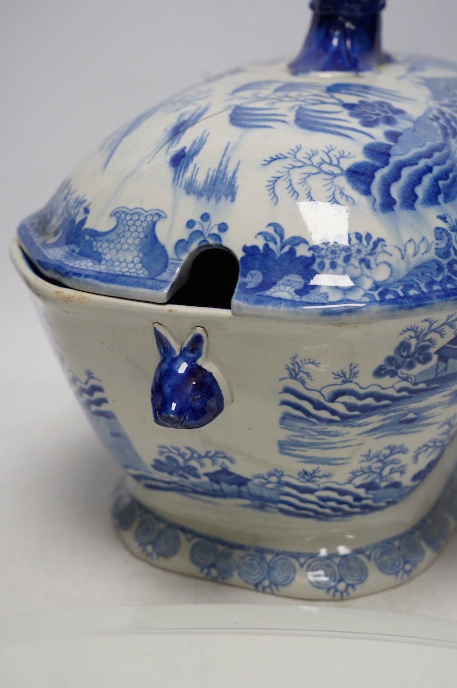 A Victorian Staffordshire blue and white pottery soup tureen and cover, together with a meat dish (2). Condition - tureen cover cracked